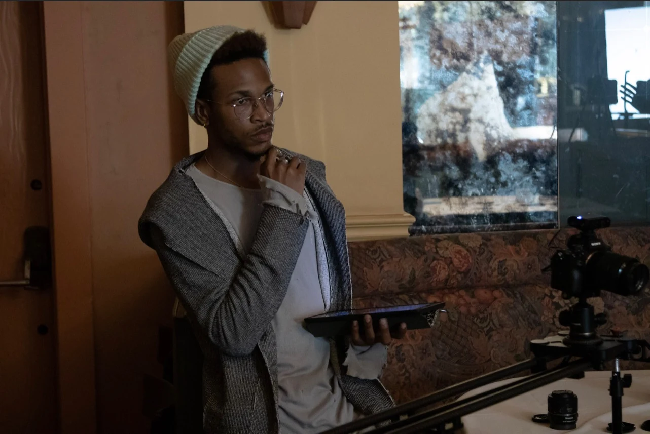 John C. Sweet III on set behind the camera